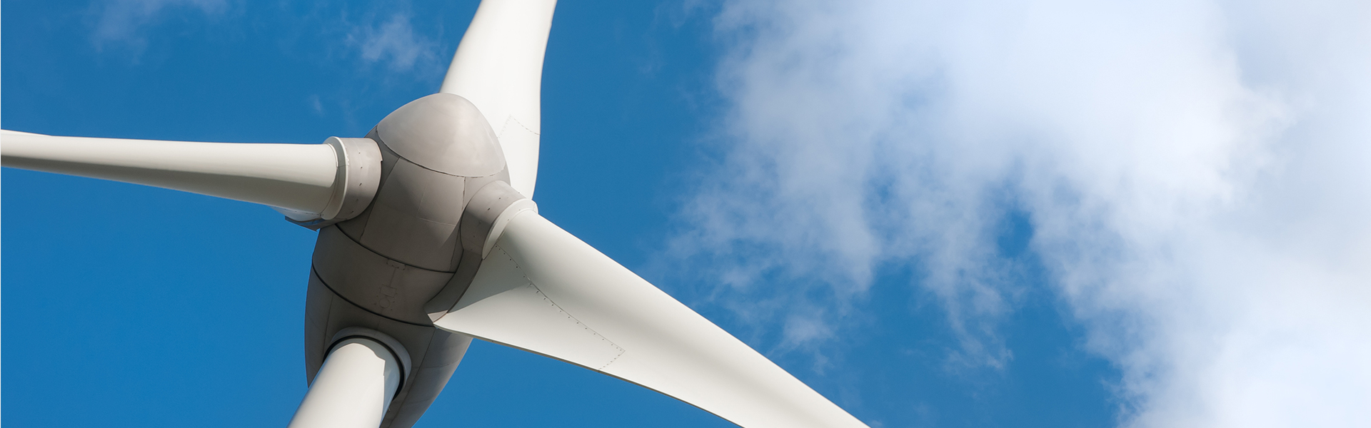 Wind turbine against a blue sky